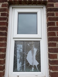 Before replacement, a badly shattered lower window pane