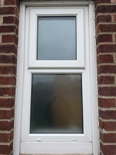 After replacement, the window fitted with new obscure glass