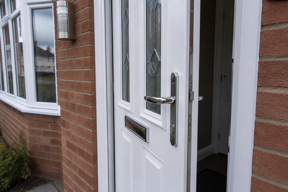 Repaired white uPVC front door on a North East home
